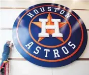  ?? MIKE STOCKER/STAFF PHOTOGRAPH­ER ?? A worker on Wednesday puts the finishing touches on the Houston Astros facility that they share with the Washington Nationals.