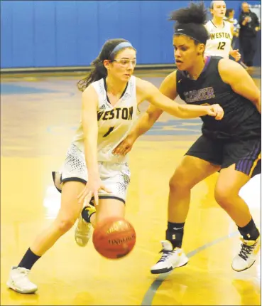  ?? Christian Abraham / Hearst Connecticu­t Media ?? Weston’s Katie Orefice drives to the basket against Career on March 10. Orefice, a senior, passed the 1,000-point mark and was named second-team All-State by USA Today as a junior.