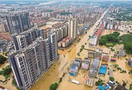  ?? AFP PIC ?? An aerial view of flooded streets after heavy rains in Qingyuan city, in China’s southern Guangdong province, yesterday.