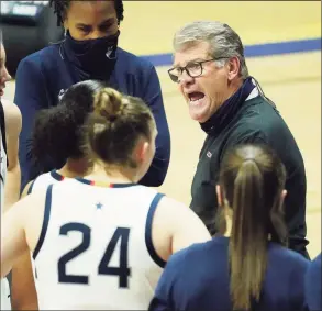  ?? David Butler II / Associated Press ?? UConn head coach Geno Auriemma talks to his players during a break in the second first half of an NCAA women’s basketball game against UMass Lowell on Saturday in Storrs.