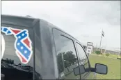  ?? DAVID GOLDMAN — THE ASSOCIATED PRESS FILE ?? A pickup with a Confederat­e flag-themed decal is parked outside the Reception and Medical Center in Lake Butler, Fla., the state’s prison hospital, where new inmates are processed.