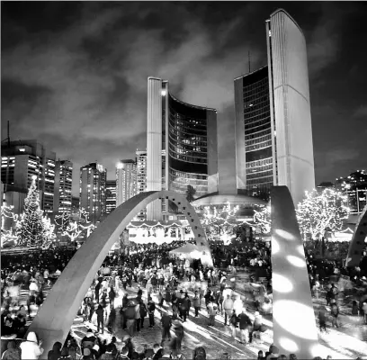  ?? LUCAS OLENIUK/STAR FILE PHOTO ?? There were no carollers or choirs singing at the Cavalcade of Lights at Nathan Phillips Square this year, only rock bands playing.