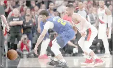  ??  ?? Denver nuggets guard Jamal Murray (third right) watches the ball go out of bounds after being knocked from his hand by Portland Trail Blazers guard CJ McCollum (second right) during the fourth overtime in game three of the second round of the 2019 nBA Playoffs at Moda Center. — USA ToDAY Sports photo