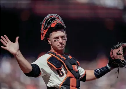  ?? STAN SZETO/USA TODAY SPORTS ?? Giants catcher Buster Posey (28) signals during a game against the Dodgers at Oracle Park on Sept. 28, 2019.