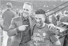  ?? Karen Warren / Houston Chronicle ?? Craig Biggio and Jose Altuve celebrate the Astros’ victory over the Yankees in Game 7 of the ALCS at Minute Maid Park.