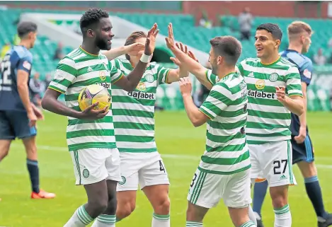 ?? Picture: PA. ?? Odsonne Edouard celebrates with team-mates after opening the scoring for Celtic.
