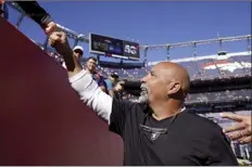  ?? AP photo ?? Raiders interim head coach Rich Bisaccia greets fans prior to Las Vegas’ 34-24 win over the Denver Broncos on Sunday.