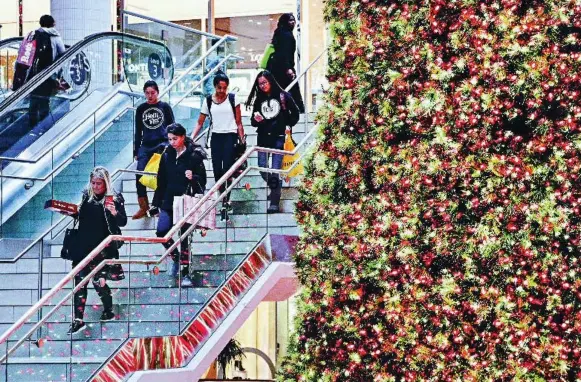  ?? ANDREW FRANCIS WALLACE/TORONTO STAR FILE PHOTO ?? Black Friday shoppers make their way through Toronto’s Eaton Centre last year. This year, many predict that deeply discounted TVs will be the biggest sellers.