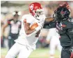  ?? [PHOTO BY IAN MAULE, TULSA WORLD] ?? Trey Sermon ran over Jah’Shawn Johnson and Texas Tech with 206 yards and three TDs on Nov. 3.