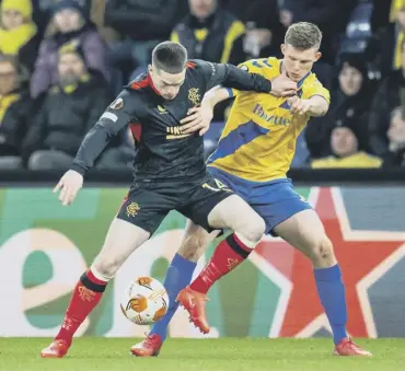  ?? ?? Rangers winger Ryan Kent holds off Brondby’s Morten Frendrup during his comeback from injury