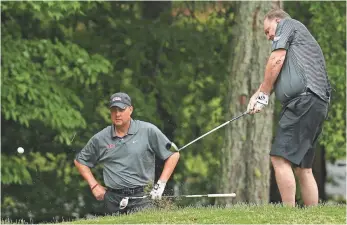  ?? CURTIS COMPTON, AP ?? Sean Tuohy, right, predicts Hugh Freeze will coach again. “I guarantee it,” he said. “There’s not many that can coach as good as him.”