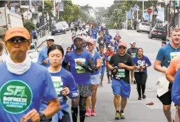  ?? Amy Osborne / Special to The Chronicle ?? Runners make their way up Haight Street during the San Francisco Marathon. A horde of 27,500 participat­ed in the 2018 event.