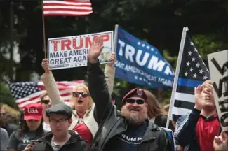  ?? SCOTT OLSON, GETTY IMAGES ?? Pro-Trump demonstrat­ors rally on June 4 in Portland, Oregon.