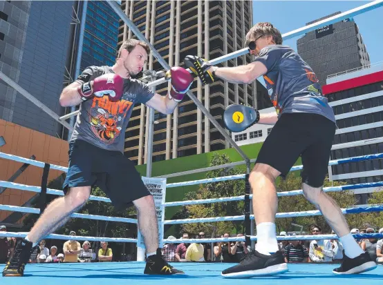  ?? FIGHTING FIT: Jeff Horn ( left) spars with his trainer Glenn Rushton during a training session at Reddacliff Place in Brisbane yesterday. ??