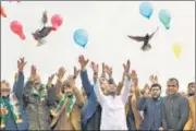  ?? AFP ?? People release balloons and pigeons as they celebrate the reduction in violence, in Jalalabad, Afghanista­n on Friday.
