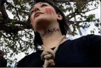  ?? — REUTERS ?? A member of the Iranian community living in Turkey with letters on her neck reads, “#no to death penalty” attends a protest in Istanbul on Saturday.