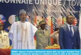  ??  ?? NIAMEY: Nigeria’s President Muhammadu Buhari (left) and Togo’s President Faure Gnassingbe attend the opening of a summit of heads of state of the Economic Community of West African States (ECOWAS) in Niamey on the creation of a single currency of...
