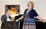  ?? BILLINGS, THE OKLAHOMAN] [PHOTOS BY NATE ?? Barbara DeMaio performs while accompanie­d by Jan McDaniel during a lunch-hour performanc­e by Painted Sky Opera at the Oklahoma City Museum of Art.