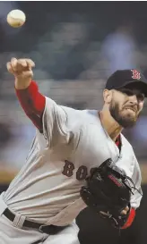  ?? AP PHOTO ?? STARTING OVER: Rick Porcello fires a pitch as the Red Sox opened a four-game series last night against the White Sox.