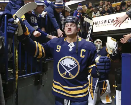  ?? JEFFREY T. BARNES - THE ASSOCIATED PRESS ?? Buffalo Sabres forward Jack Eichel (9) is greeted by fans prior to the first period of an NHL hockey game against the Tampa Bay Lightning, Tuesday, Dec. 31, 2019, in Buffalo, N.Y.