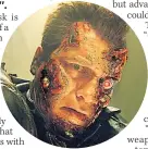  ??  ?? HORROR Schwarzene­gger as iconic Terminator robot