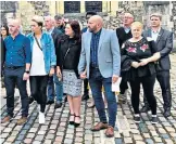  ?? ?? Guilty: Bob Higgins (far left) and some of his victims, their families and supporters after his conviction at Winchester Crown Court in 2019