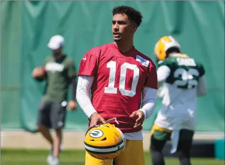  ?? The Associated Press ?? Green Bay Packers quarterbac­k Jordan Love takes part in mini-camp June 8 in Green Bay, Wis. Love is the heir apparent to the position once Aaron Rodgers retires, moves on or is traded — whenever that may be.