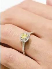  ??  ?? Dropping hints: Tiffany Soleste cushion-cut yellow diamond engagement ring