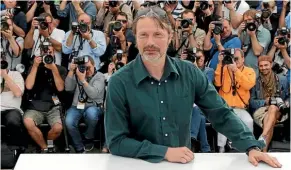  ??  ?? Mads Mikkelsen poses for a photocall at the Cannes Film Festival, where he has won the best actor award and has served on the jury.