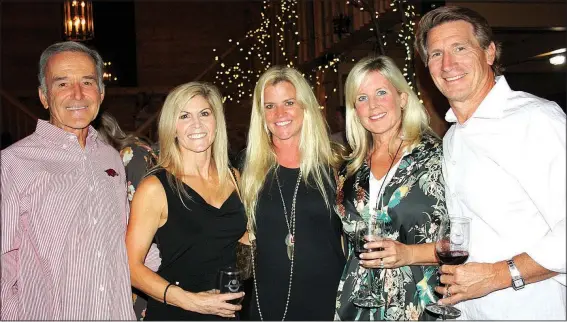  ?? NWA Democrat-Gazette/CARIN SCHOPPMEYE­R ?? Carl Collier (from left), Meredith Dowse, Helen Carlton and Leslie and Scott Bailey help support Restore Humanity at Winetopia on Oct. 6.