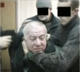  ??  ?? Left: A policeman at the scene where Sergei Skripal and his daughter were found unconsciou­s in Salisbury. Above: This video shows Sergei Skripal being detained some years ago. Above right: Yulia Skripal. Below: Witness Freya Church