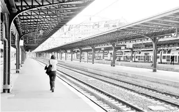  ?? — AFP photo ?? File photo of a woman walking on a platform at the Gare de l’Est train station in Paris.