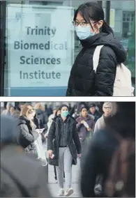  ?? PICTURES: PA WIRE ?? EXTRA CARE: Top, a woman in a mask walks past the Trinity Biomedical Sciences Institute, part of Trinity College Dublin’s city centre campus. Below A mask wearer on Oxford Street, London.