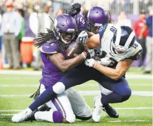  ?? Bruce Kluckhohn / Associated Press ?? Minnesota safety Anthony Harris strips the ball from Cooper Kupp at the Vikings’ 1- yard line in the second quarter.