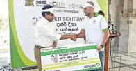  ??  ?? Chief Commercial Officer Etisalat Lanka Yasser Aboulamaye­m handing over a cheque for 100 cataract surgeries to Director General Health & National Focal Point of the Vision 2020 Programme Dr. P. G. Mahipala