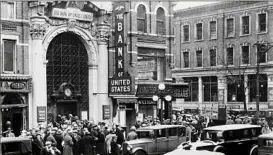  ?? Associated Press ?? Crowds gather Dec. 11, 1930, outside the Brownsvill­e branch of the Bank of the United States in New York City after it was ordered to shut down and taken over by the state Banking Department.