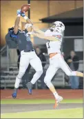  ?? JAMES C. SVEHLA/DAILY SOUTHTOWN ?? Lincoln-Way East’s A.J. Henning catches a pass for a touchdown as St. Charles East’s Nathan Hull defends during a Class 8A first-round playoff game Friday.