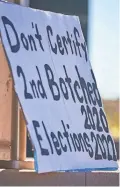  ?? ALEX GOULD/THE REPUBLIC ?? A sign at Wesley Bolin Memorial Plaza in Phoenix on Nov. 25 calls for the 2022 general election to not be certified.