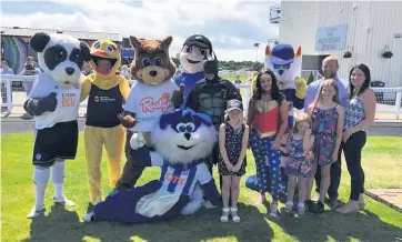  ??  ?? Ready to run Panda, far left, and the other mascots in the parade ring