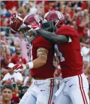  ?? BUTCH DILL — THE ASSOCIATED PRESS ?? Alabama wide receiver Derek Kief (81) celebrates with wide receiver Tyrell Shavers (14) after scoring a touchdown against Arkansas State during the second half of an NCAA college football game, Saturday in Tuscaloosa, Ala. Alabama won 57-7.