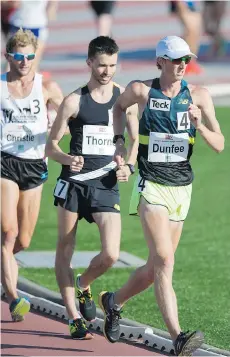  ?? GERRY KAHRMANN ?? Olympic race walker Evan Dunfee gets an early lead before finishing second in the mile at the Vancouver Sun Harry Jerome Track Classic on Wednesday at Percy Perry Stadium in Coquitlam.