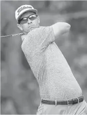  ?? SAM GREENWOOD/GETTY IMAGES ?? Adam Scott of Australia finished with a 72 Monday to qualify by a single shot for next week’s US Open.