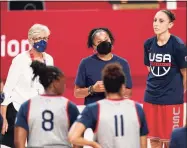  ?? Charlie Neibergall / Associated Press ?? United States head coach Dawn Staley, center, talks to her team during a women’s basketball practice at the 2020 Summer Olympics on Saturday in Saitama, Japan.