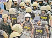  ??  ?? Journalist Kavitha Jakkal being escorted by the police to Sabarimala Temple on Friday.