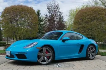  ?? DAN ILIKA/AUTOGUIDE.COM ?? The 2017 Porsche Cayman S starts at $76,800. The Miami Blue paint adds $2,950 to the price.