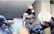  ?? OUPA MOKOENA African News Agency (ANA) ?? SHEPHERD Bushiri greets his followers outside the Specialise­d Commercial Crimes Court after he was granted bail on Wednesday. |