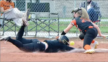  ??  ?? PILOT PHOTO/RON HARAMIA RIGHT: Argos’ Carleigh Miller gets in safely at third base after breaking up the throw to Culver third baseman Marissa Milam.