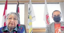  ?? FEDERATION OF SOVEREIGN INDIGENOUS NATIONS • HANDOUT VIA REUTERS ?? Cowessess First Nation Elder Florence Sparvier, left, and Chief Cadmus Delorme discuss the discovery of the unmarked graves of hundreds of people, in a still image from a videoconfe­rence in Grayson, Sask. on Thursday.