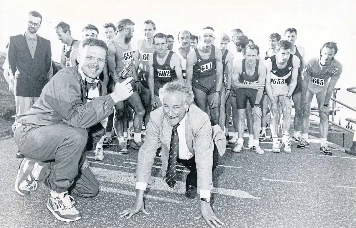  ??  ?? ON YOUR MARKS: Broadcaste­r Robbie Shepherd all set as Dons star Alex McLeish starts Metro Aberdeen’s charity race for the VSA Easter Anguston fund on June 19 1991.