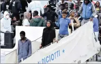  ?? PICTURE: ORIETTA SCARDINO/ANSA ?? Migrants disembark from the Italian Coast Guard ship Diciotti with 900 rescued migrants and two bodies in Catania, Italy, yesterday.